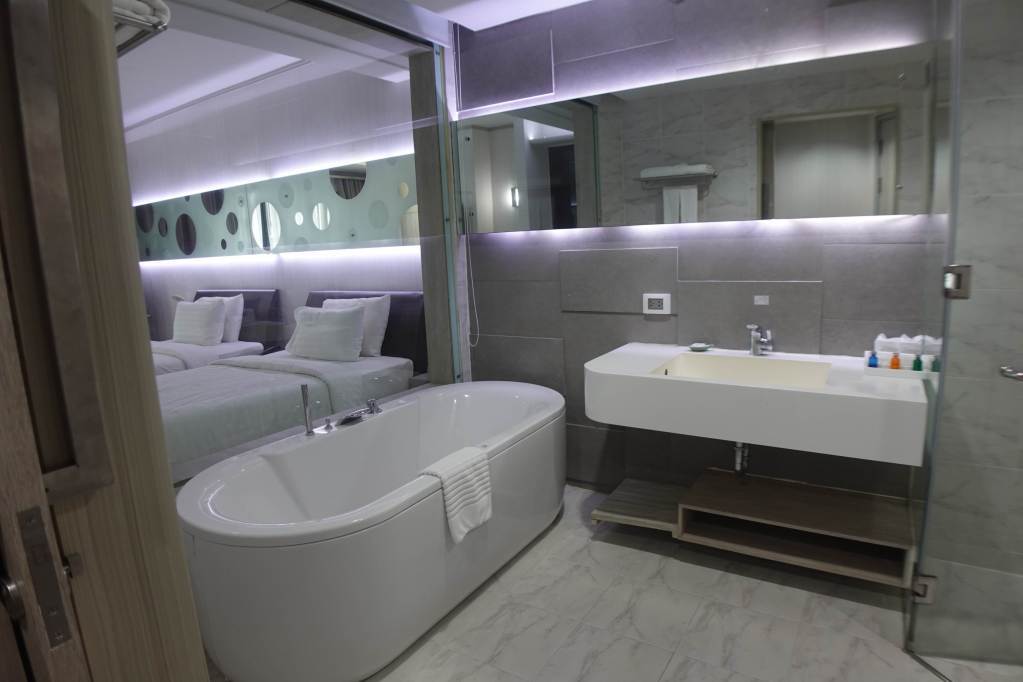 Bathroom at Pattaya Discovery Beach Hotel in Thailand.