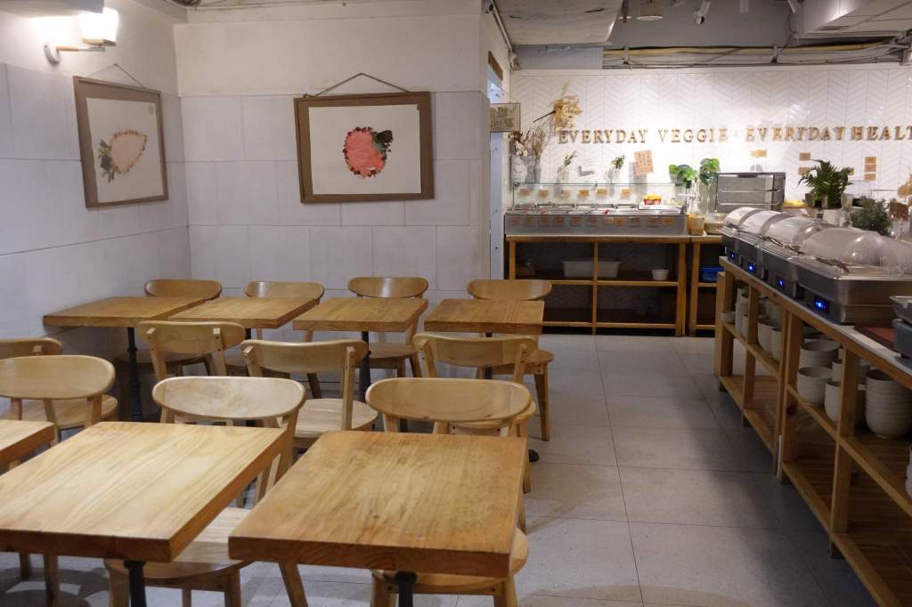 Wooden tables at Everyday vegetarian restaurant in Hong Kong.