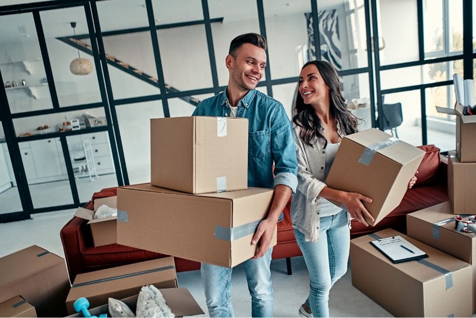 A family unpacking boxes in their new apartment after moving to Bangkok.