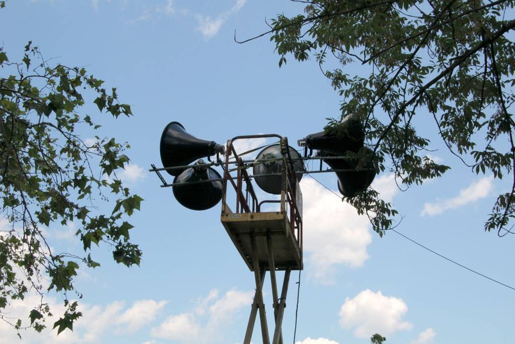 Loudspeakers in a park.