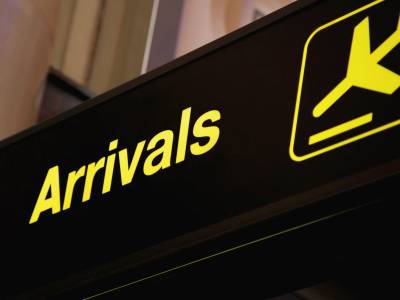 Airport 'Arrivals' sign.