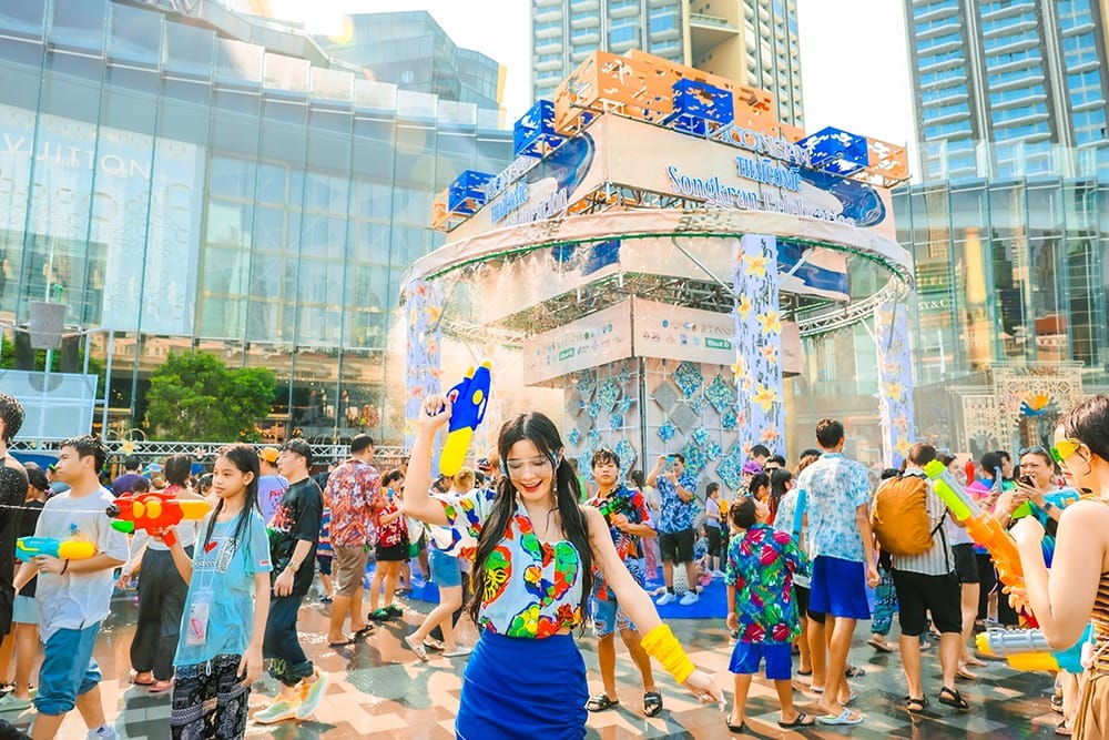 People with water guns celebrating Songkran at ICONSIAM in Bangkok.