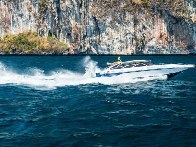 Speedboat travelling across water in Phuket, Thailand.