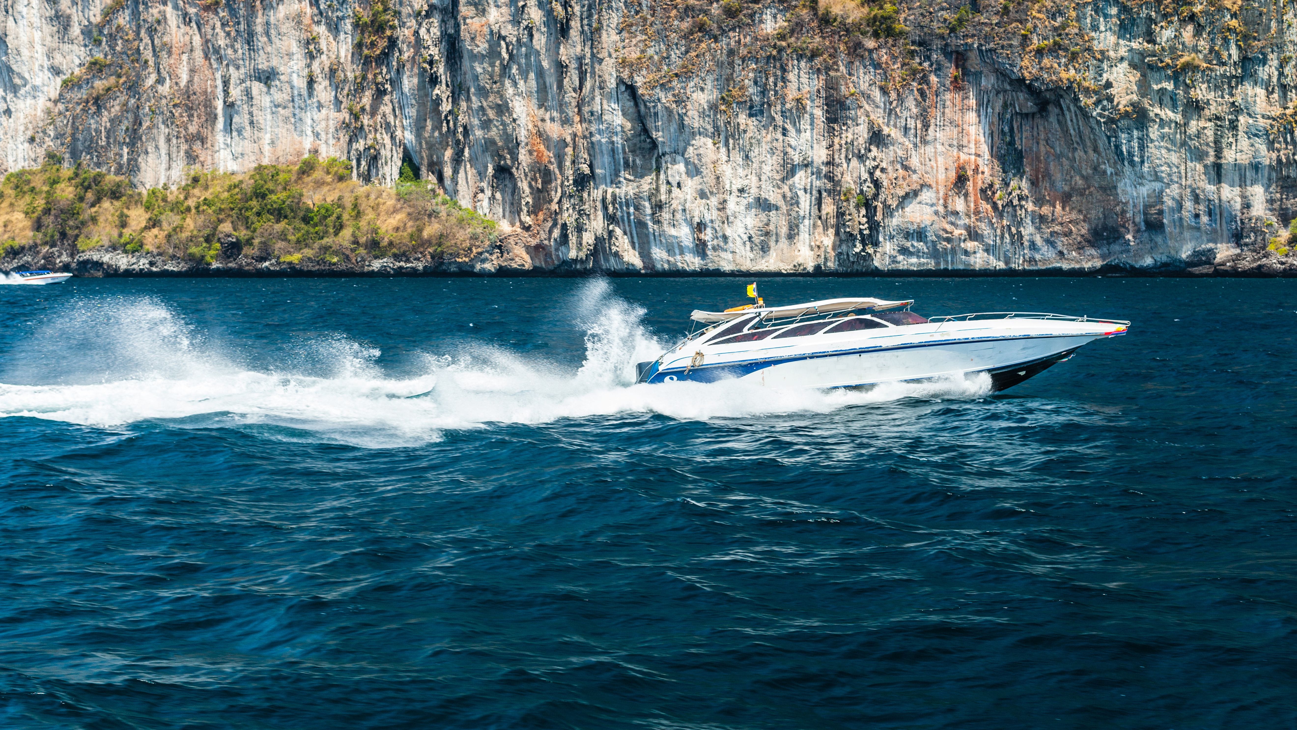 Speedboat travelling across water in Phuket, Thailand.