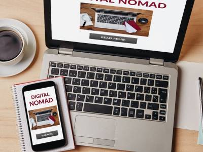 Digital nomad's laptop and mobile phone.