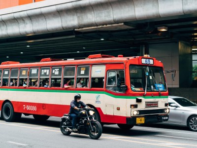 Number-65 bus driving along in Bangkok.