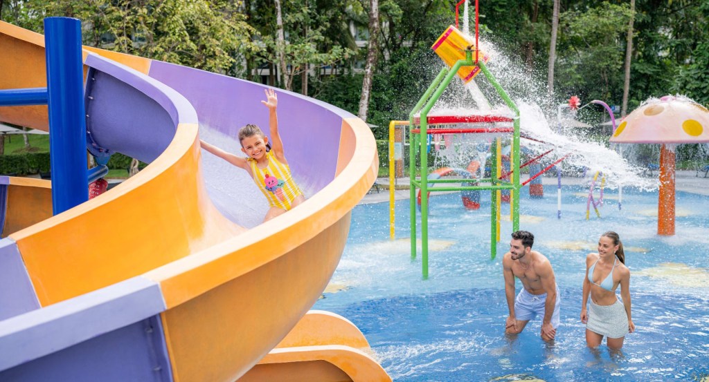 Child playing on slide at Avani+ Khao Lak Resort in Thailand.
