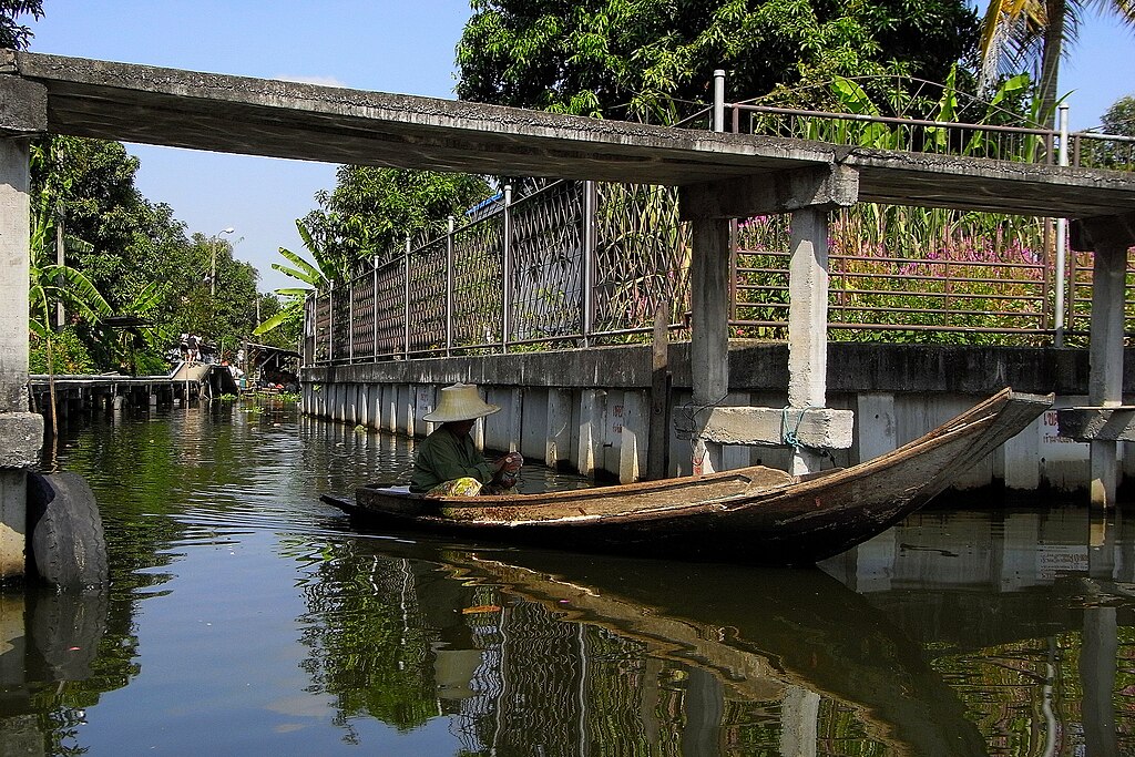 Person in boat in canal in Phra Khanong, Bangkok.
