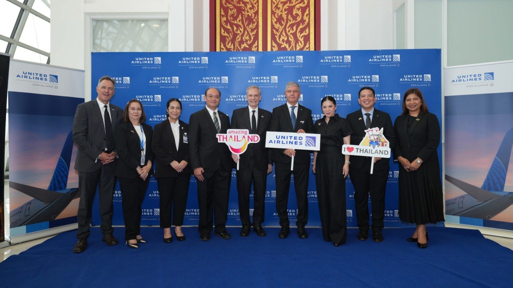 Officials from the Tourism Authority of Thailand and United Airlines during the inaugural Los Angeles–Bangkok flight welcome event at Suvarnabhumi Airport.
