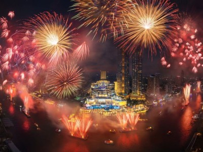 Fireworks over ICONSIAM in Bangkok during New Year countdown.