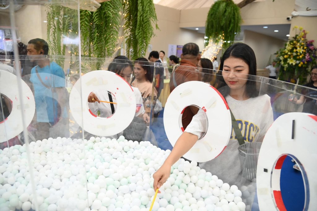 A woman at the lucky draw at the Thai Red Cross Fair.