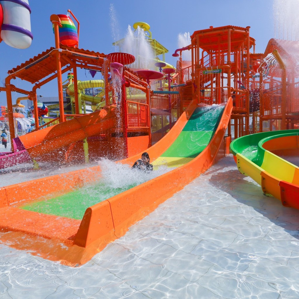 Person sliding down slide at Harbor Island – The Mall Lifestore Bang Kapi in Bangkok.