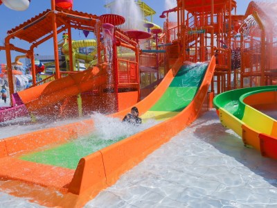Person sliding down slide at Harbor Island – The Mall Lifestore Bang Kapi in Bangkok.