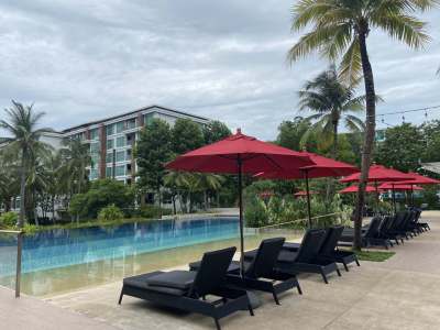 Sunloungers by pool at Amari Hua Hin in Thailand.