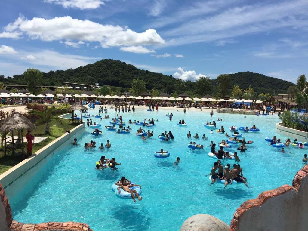 People floating on inflatables at Ramayana Water Park in Thailand.